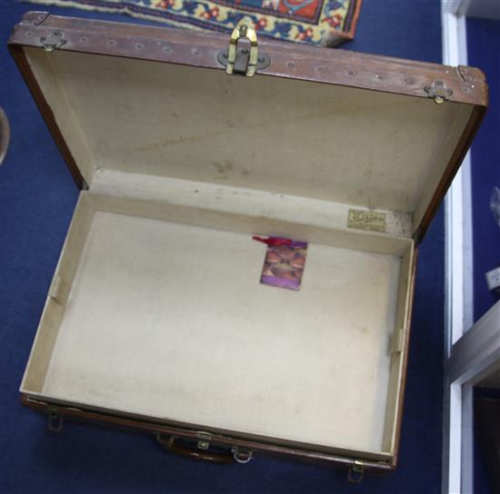 A Louis Vuitton leather suitcase, 26 x 16.5 x 8.5in.